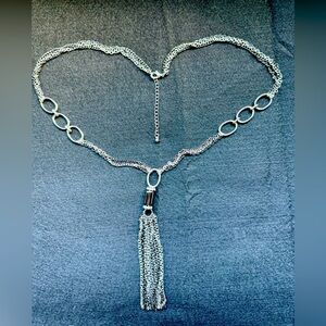 31” silver metallic chain necklace with beautiful tassel detail.